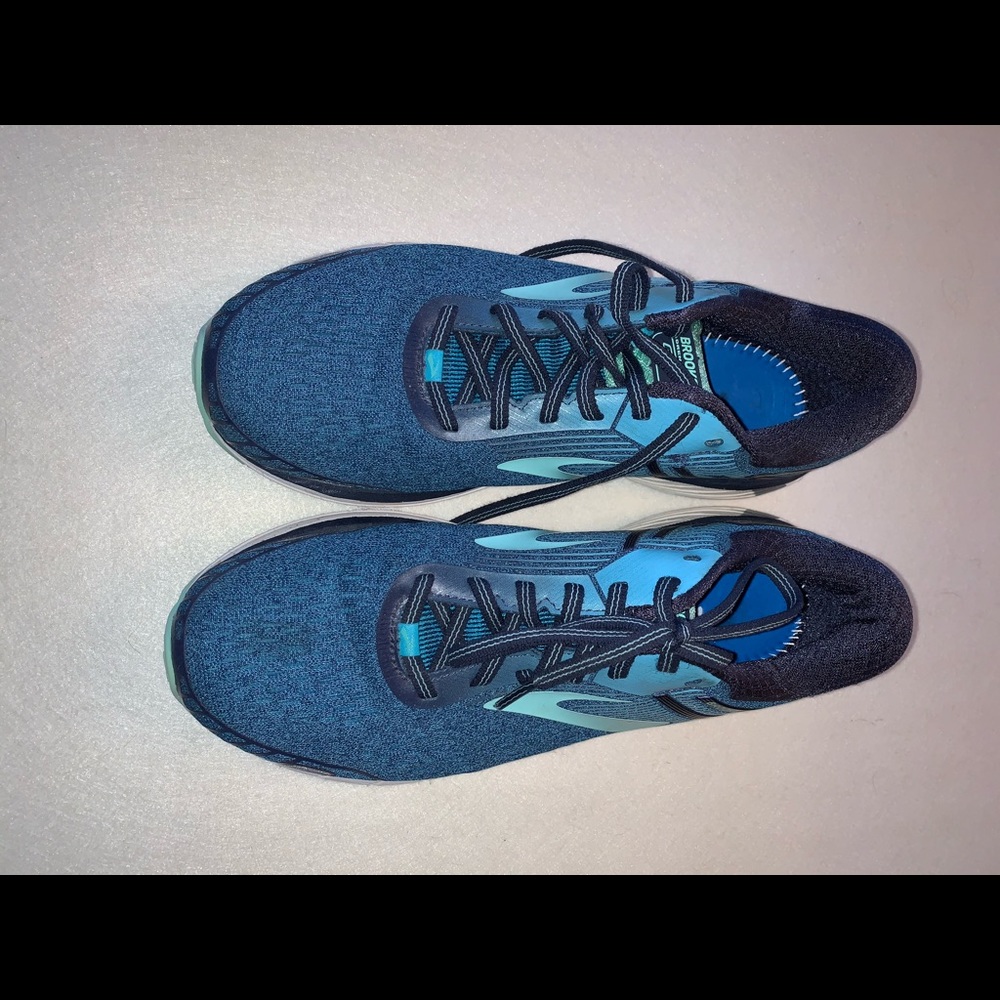 Turquoise blue Brooks sneakers.